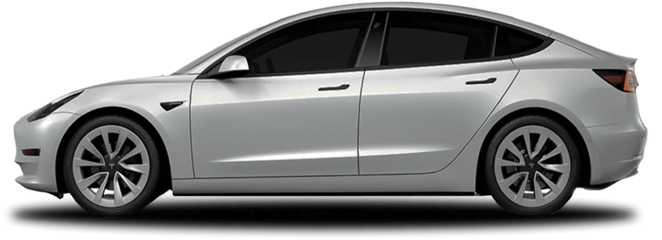Side view of a silver Tesla Model 3, a sleek electric sedan with aerodynamic curves, dark-tinted windows, and sporty alloy wheels.